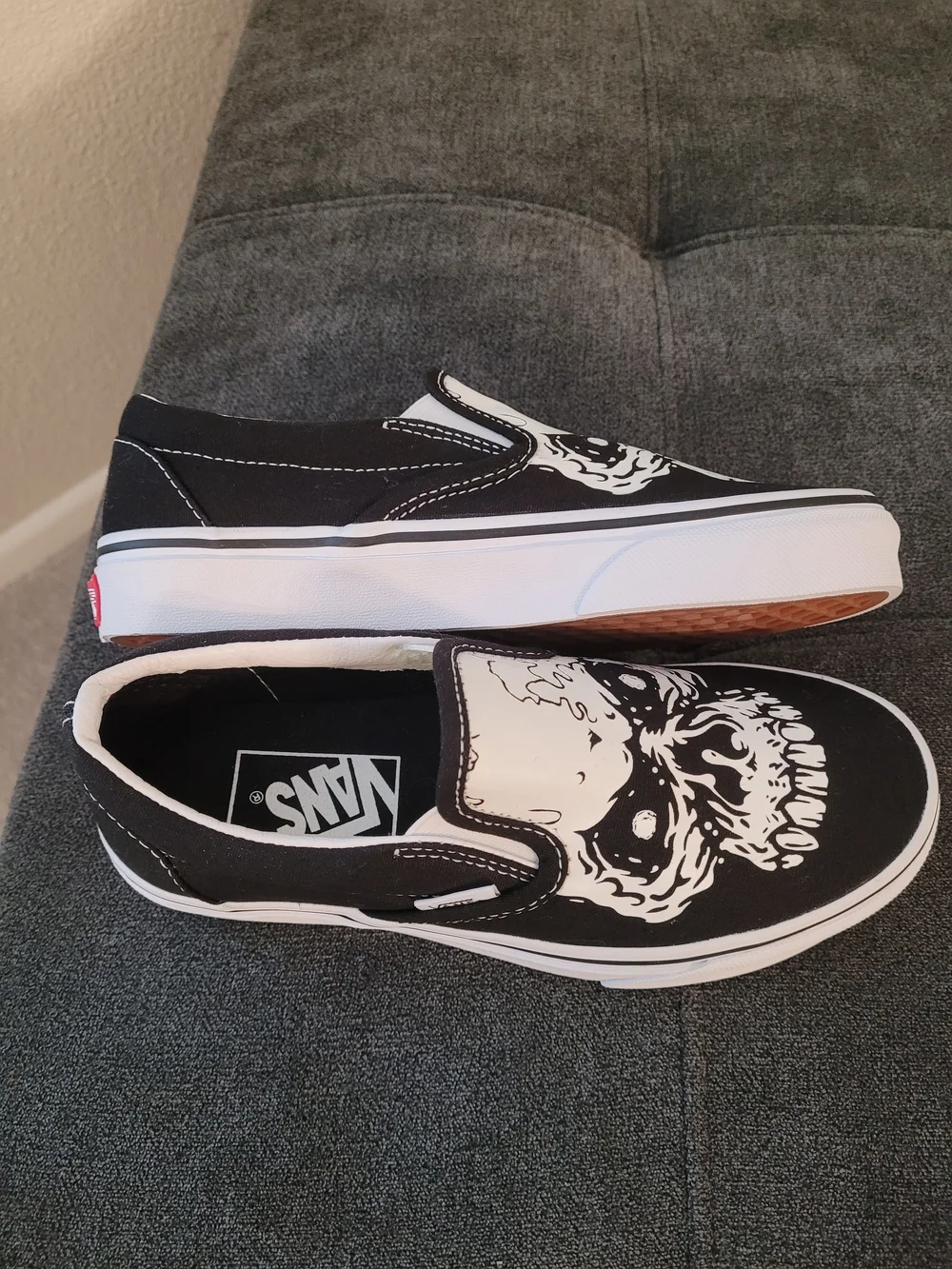 Vans Classic Kids Black & White Slip-On Sneakers with Skull Graphic